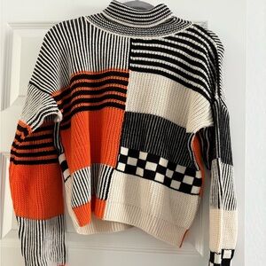 Nasty Gal Black, White, and Orange Patchwork Turtleneck Sweater
